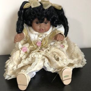 Beautiful vintage ceramic girl windup doll with gold dress